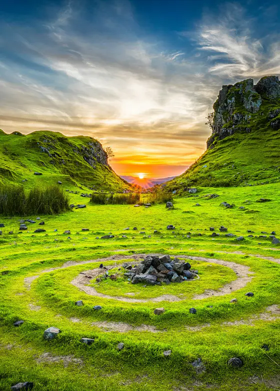 Low sun across an open field of grass
